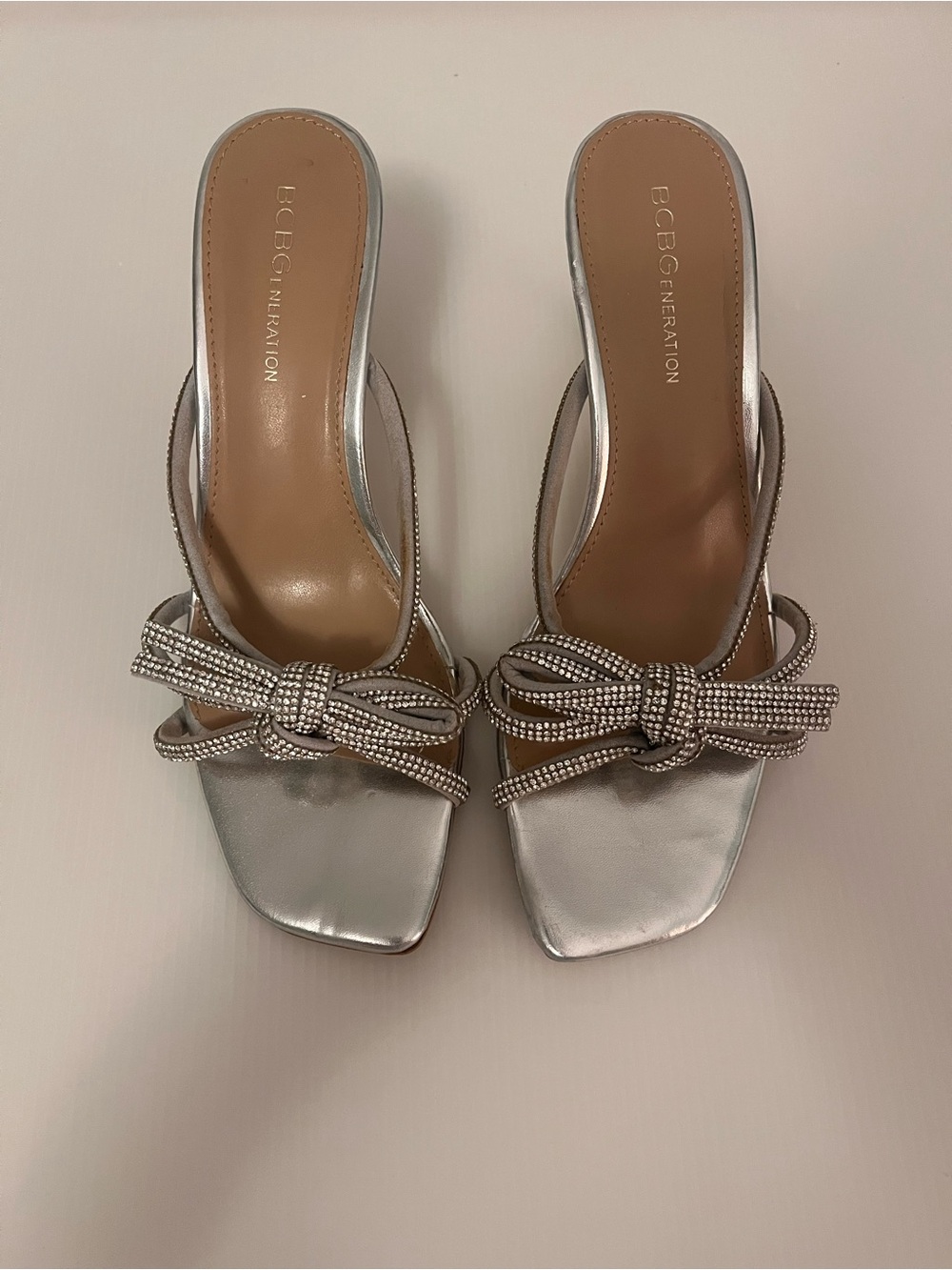 BCBGeneration Metallic Silver Bow-Accent Slide Mules